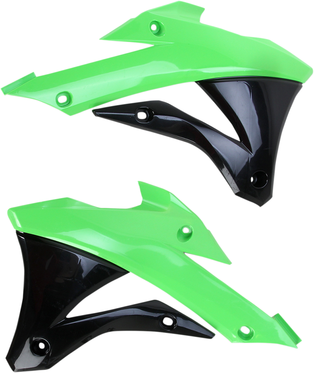 A close-up of Acerbis radiator shrouds in green and black, designed for motorcycle body protection, showing their vibrant color and shape.
