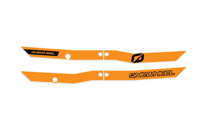 Onewheel XR Classic FluOrange Recurve Rail Guards protecting the skateboard's rails with bright orange color and sleek design.