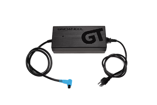 Onewheel GT-S Series Hypercharger for fast charging, with sleek black design and compact size, compatible with Onewheel electric skateboards.