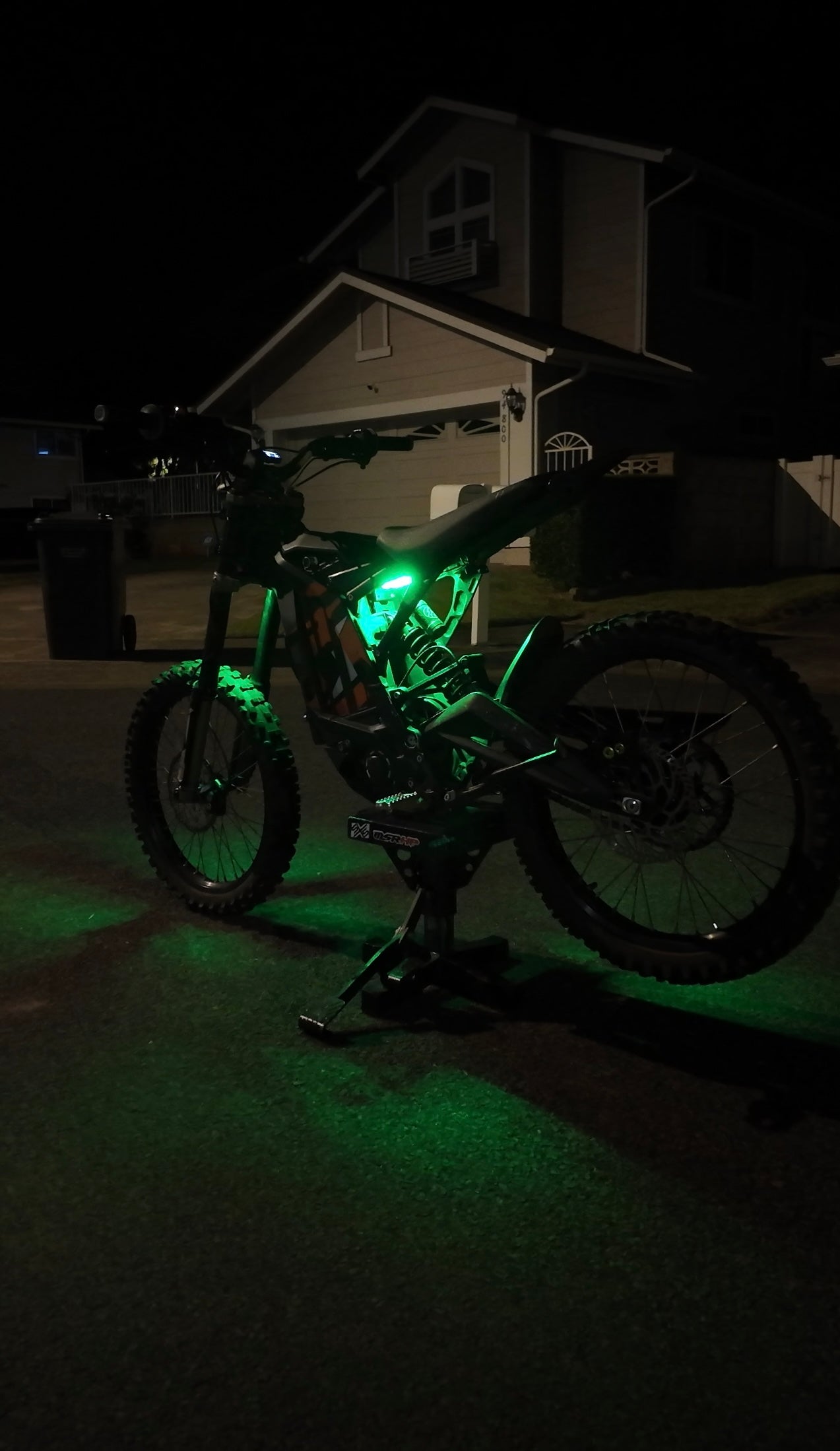 Green underglow kit installed on the rear of a TALARIA MX4/MX5 electric motorcycle by Project9.