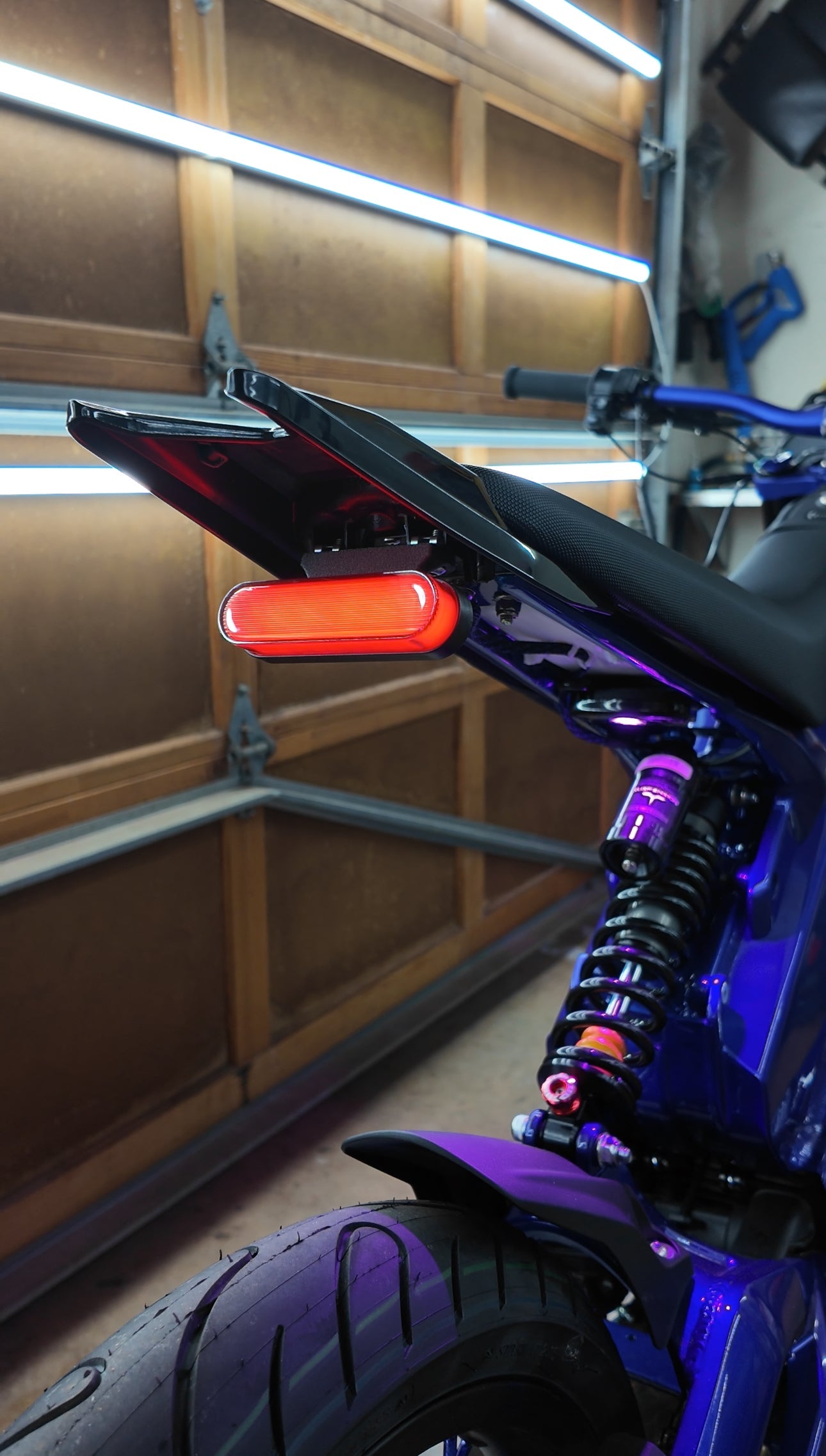 Project 9 Cyber Brake Light for Talaria XXX mounted on the bike, showcasing its sleek, functional design and bright LED illumination.