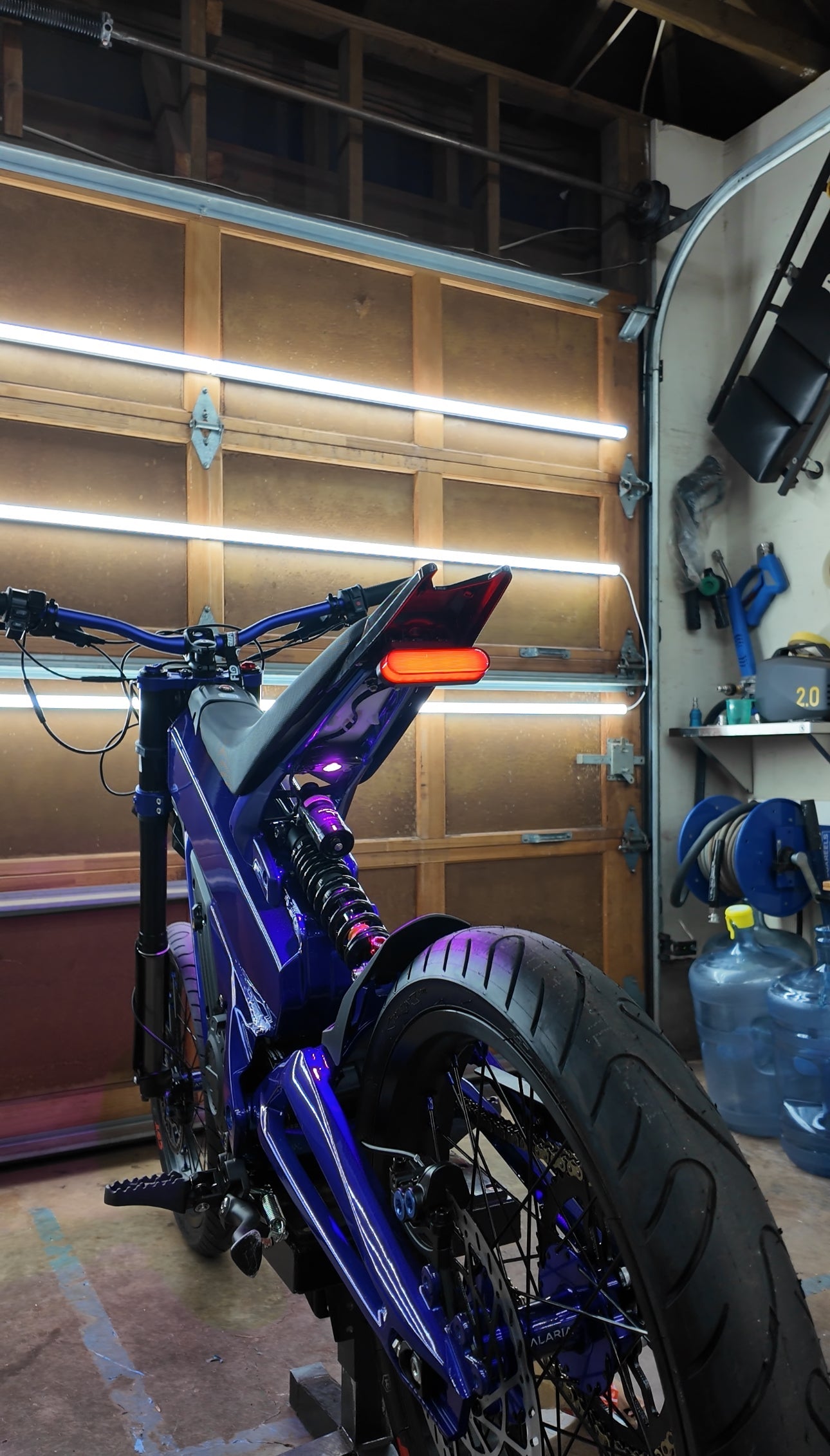 Project 9 Cyber Brake Light for Talaria XXX electric scooter, showing sleek red LED brake light mounted on the scooter.