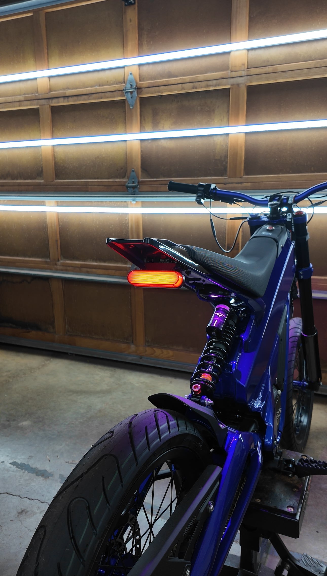 Project 9 Talaria XXX cyber brake light installed on motorcycle, showcasing sleek design and bright LED illumination.
