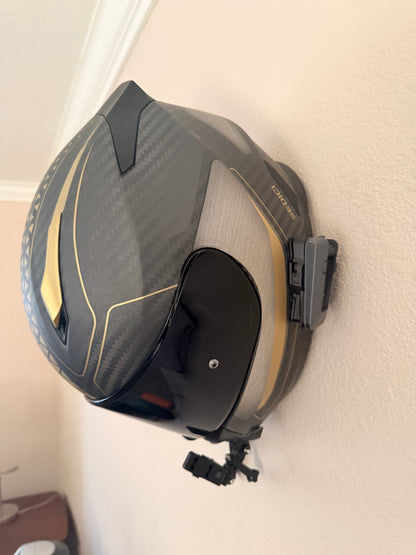 Slim-Flush motorcycle helmet wall mount by McCoy Industries, securely holding a helmet on a wall with a sleek design.