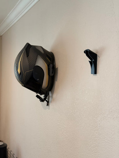 Slim-Flush motorcycle helmet wall mount by McCoy Industries mounted on wall, designed to securely hold a motorcycle helmet.