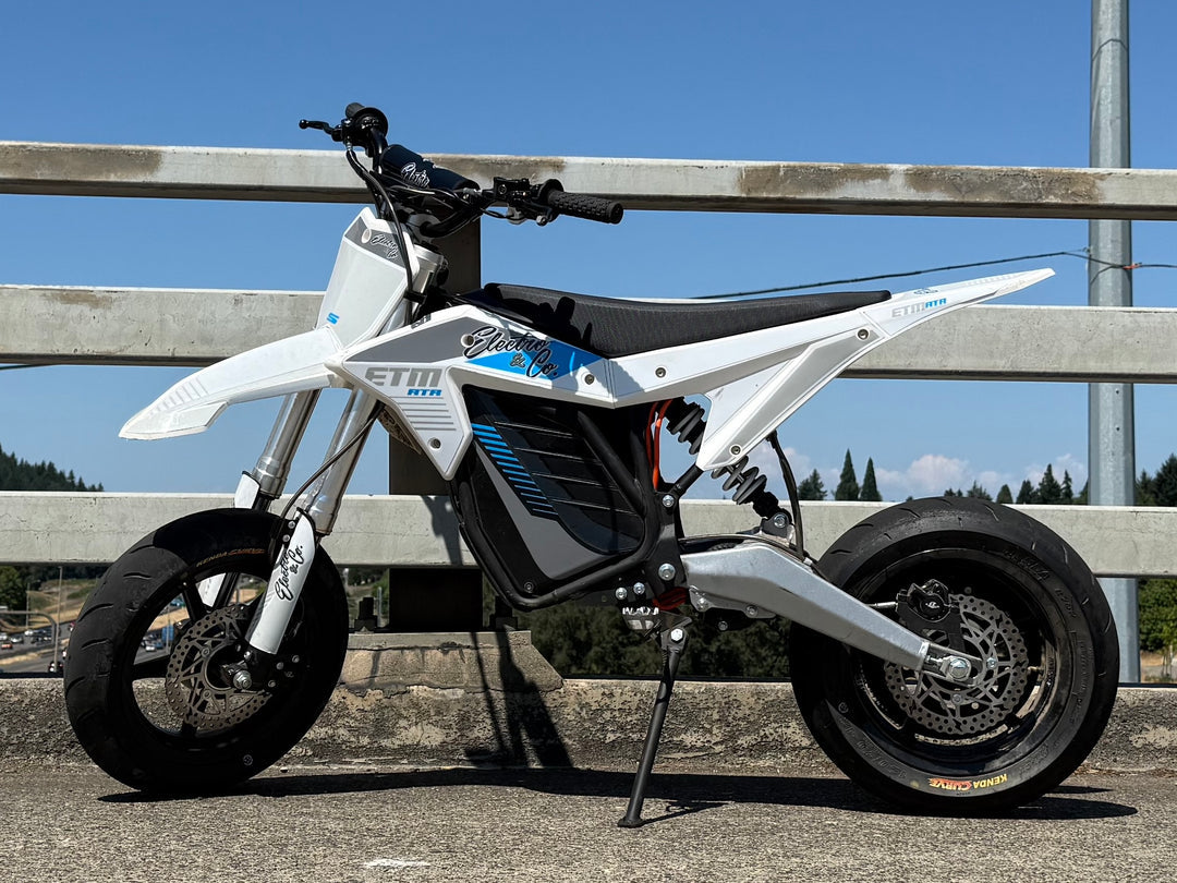 Electro & Co ETM RTR 12-inch mag wheel set with Kenda tires, rotor, sprocket, and chain on a white background.
