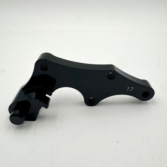 Warp9Racing Bracket 17 Late 2010s BETA engine part shown in image IMG_2582.jpg, featuring durable metal construction.