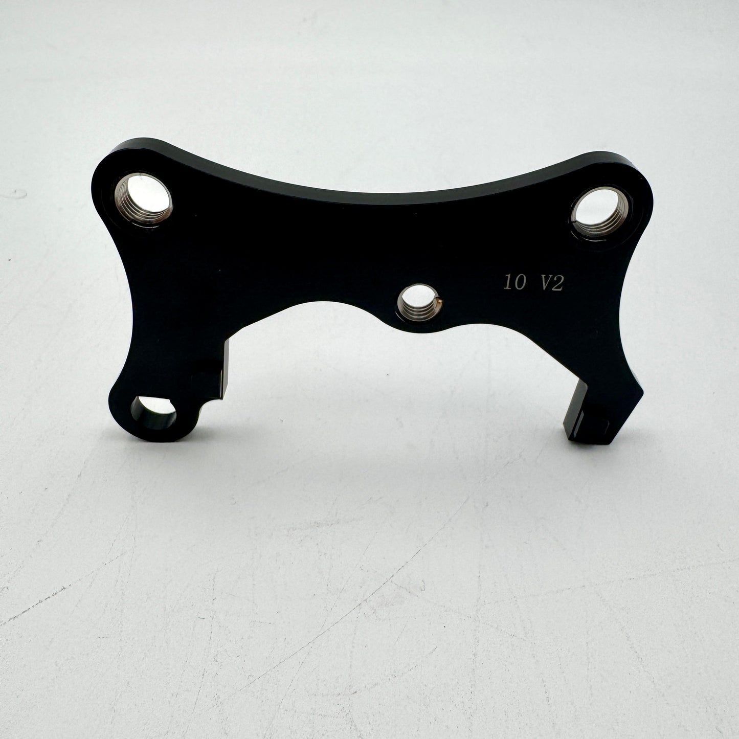 Warp9Racing Bracket 10 Gen 2 for KLR650 motorcycle, mounted on the bike, showing durable metal construction and installation details.