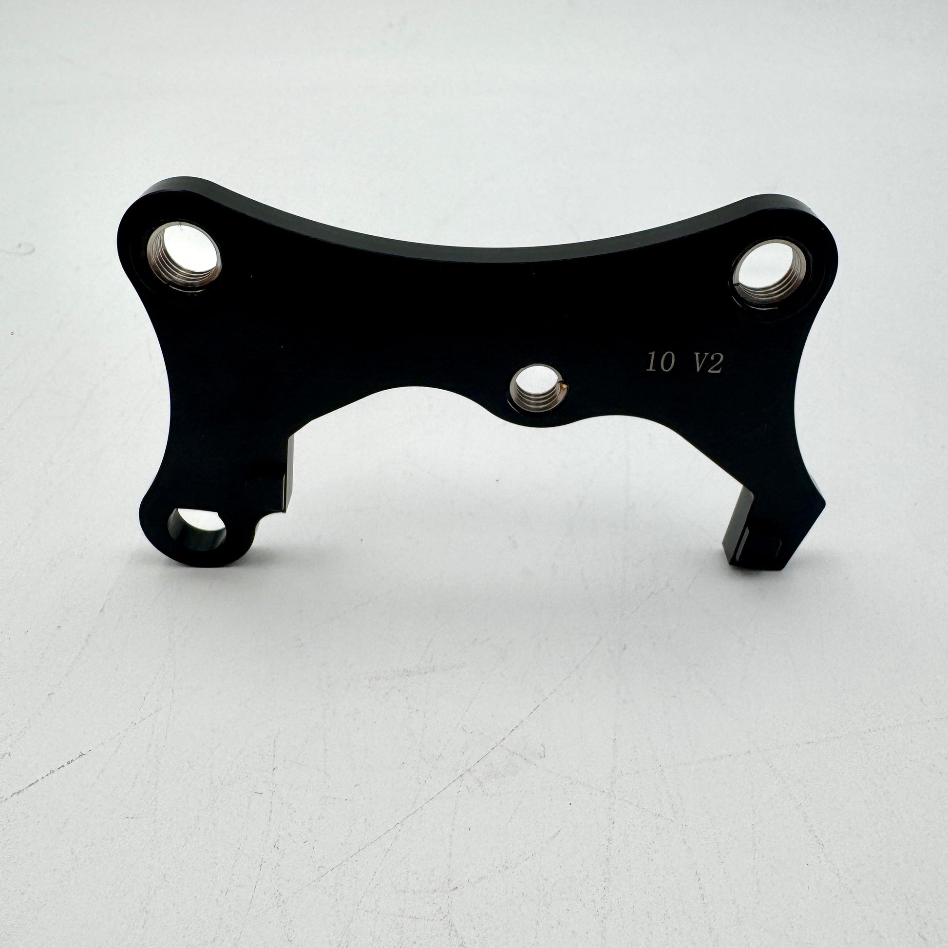 Warp9Racing Bracket 10 Gen 2 for KLR650 motorcycle, mounted on the bike, showing durable metal construction and installation details.