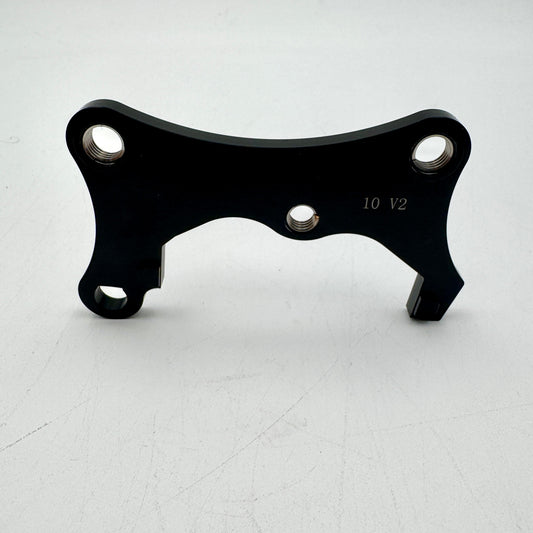 Warp9Racing Bracket 10 Gen 2 for KLR650 motorcycle, mounted on the bike, showing durable metal construction and installation details.