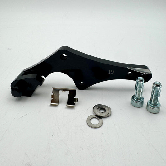 Warp9Racing bracket for KTM, Husqvarna, Gas Gas, Husaberg, Stark, and Triumph motorcycles, shown in black metal.