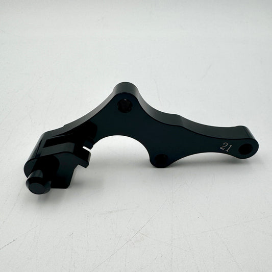 Warp9Racing Bracket 21 CRF mounted on motorcycle frame, showing sturdy metal construction and installation details.
