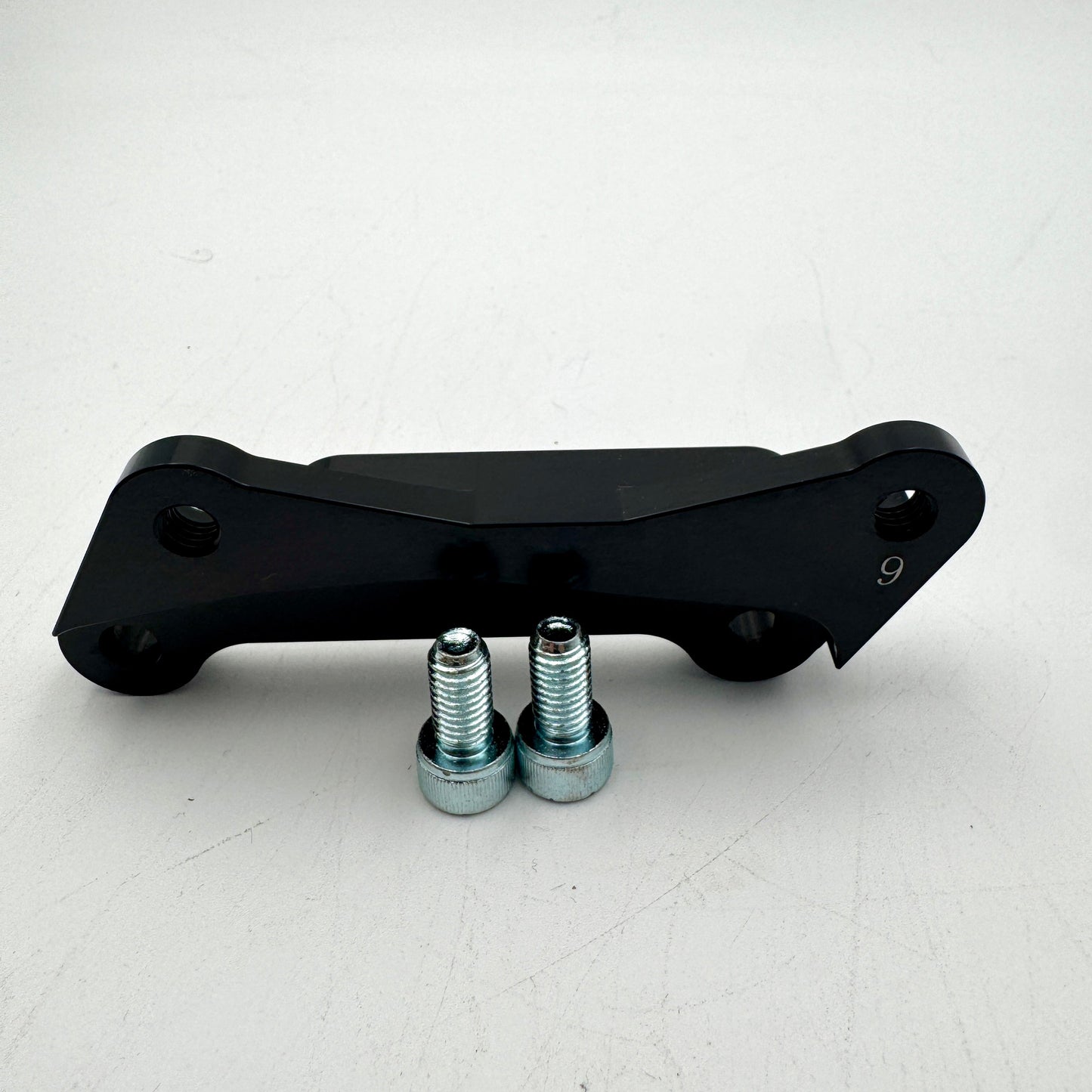 Warp9Racing Bracket for 9th Gen KLR650 motorcycle, showing the sturdy metal mounting bracket on a plain background.