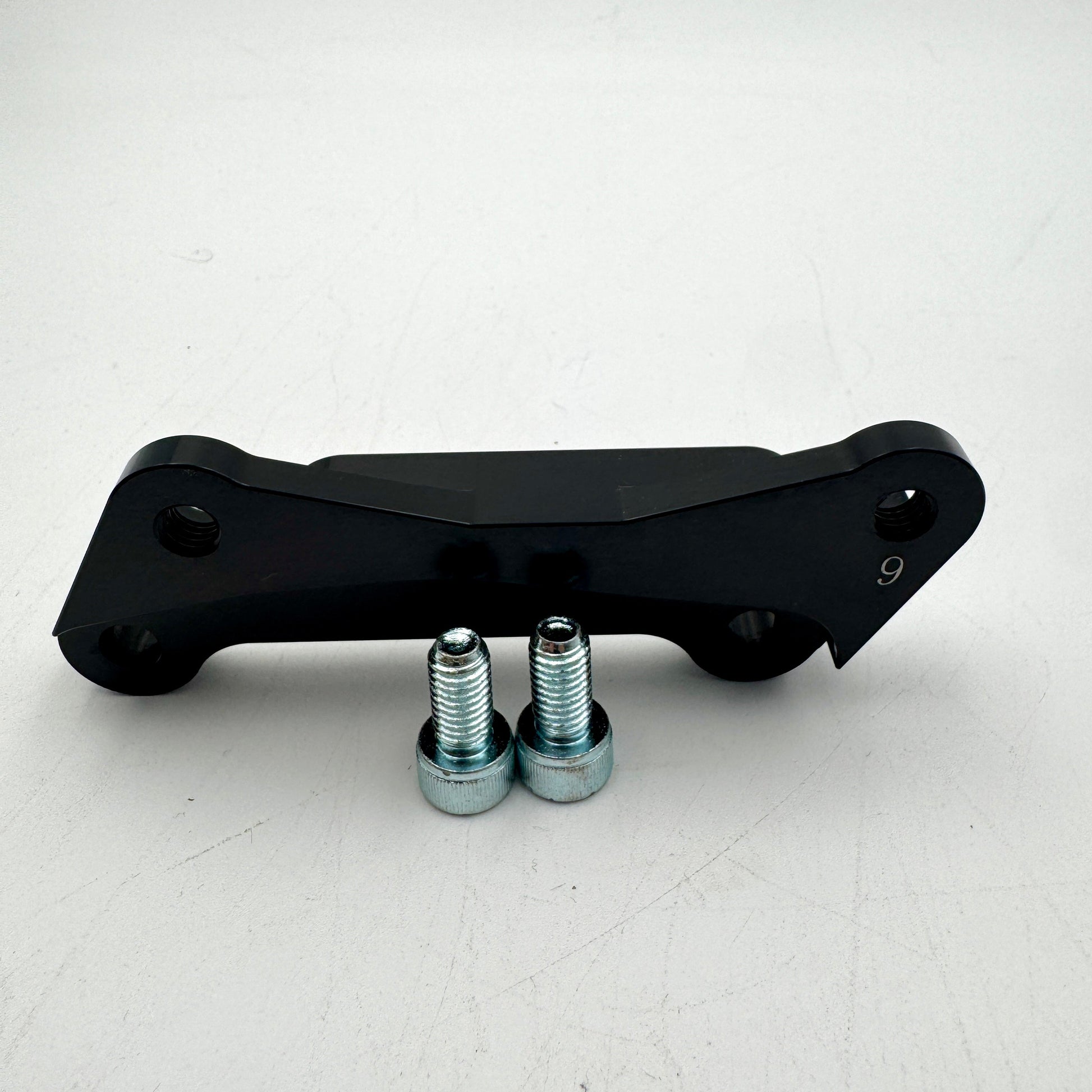 Warp9Racing Bracket for 9th Gen KLR650 motorcycle, showing the sturdy metal mounting bracket on a plain background.