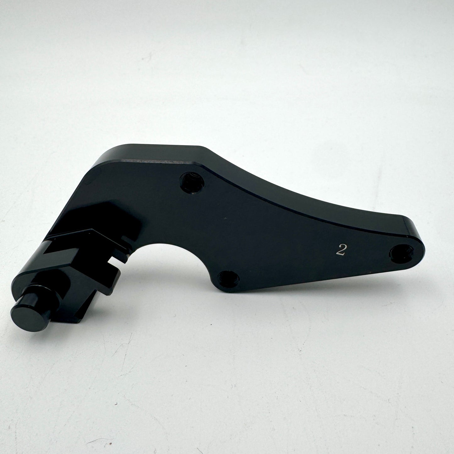 Warp9Racing Bracket 2 Early CRF motorcycle part mounted on a bike, showcasing its sturdy construction and precise fit.