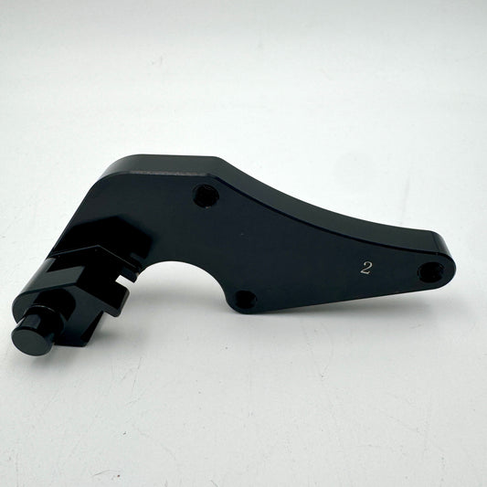Warp9Racing Bracket 2 Early CRF motorcycle part mounted on a bike, showcasing its sturdy construction and precise fit.