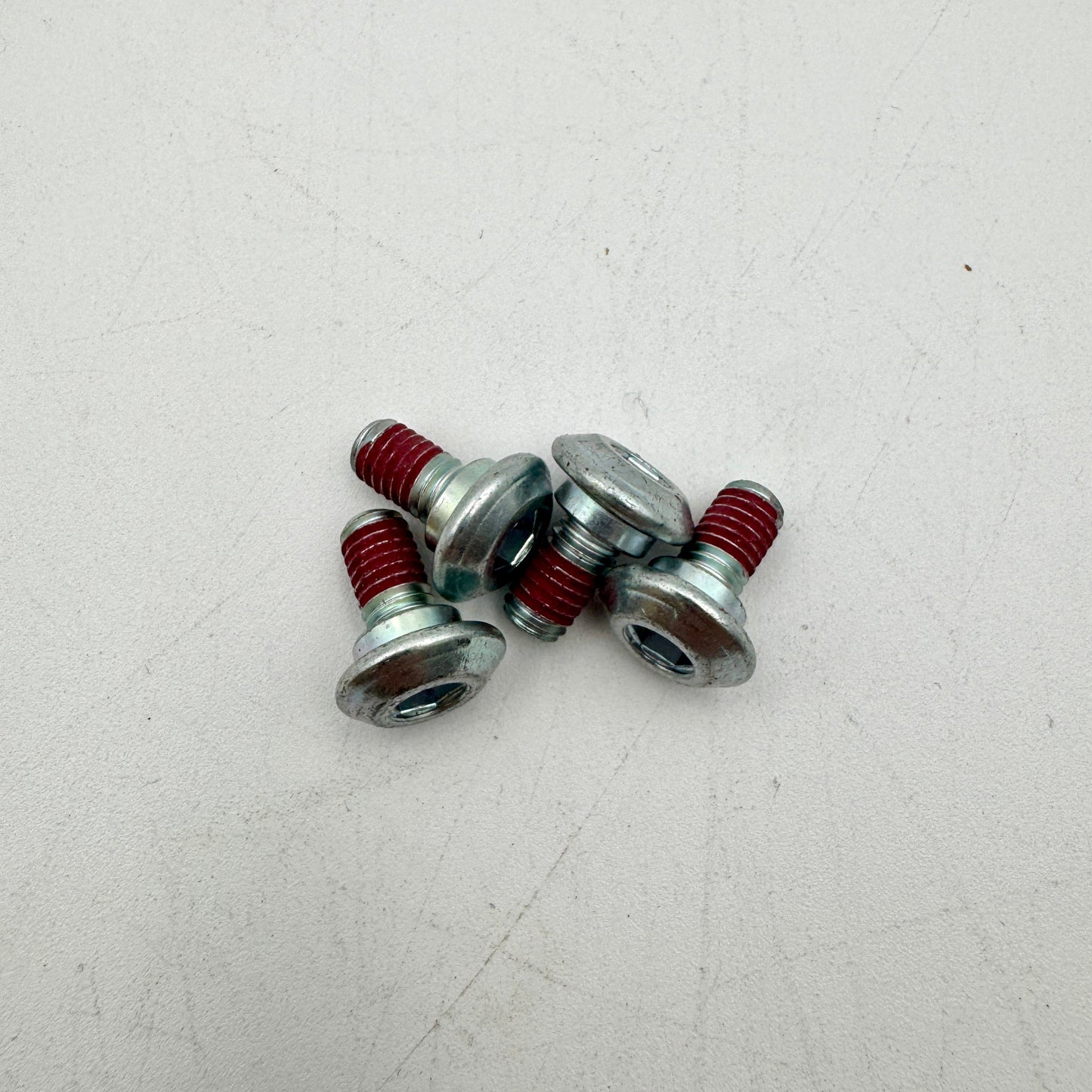 Close-up of Warp9Racing M6X10-FA Kawi Rotor Bolt showing its metallic finish and precise threading.