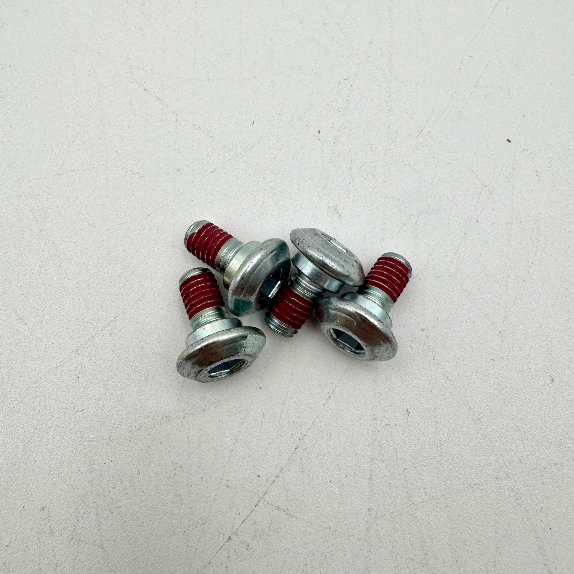 Close-up of Warp9Racing M6X10-FA Kawi Rotor Bolt showing its metallic finish and precise threading.