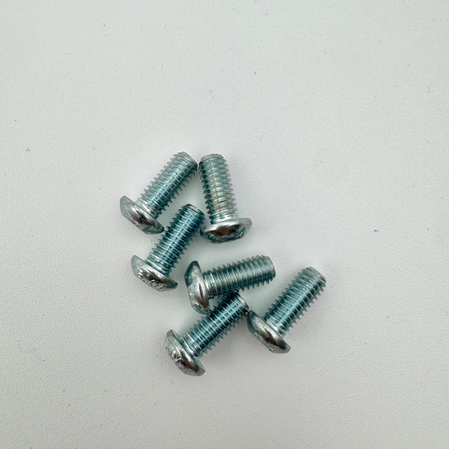 Warp9Racing M6X13-BHT 690 rotor bolts shown, metallic bolts with threaded shanks and hex heads for motorcycle braking systems.