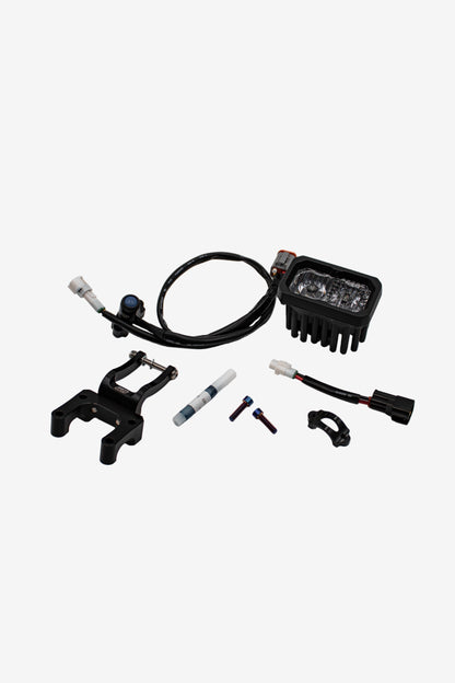 Warp9Racing V2 High-Output Headlight with W9 Mounting, showcasing a sleek automotive headlight assembly on a vehicle.