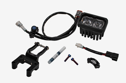 Warp9Racing V2 High-Output Headlight with W9 Mounting on vehicle, showcasing durable construction and advanced lighting features.