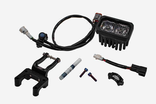 Warp9Racing V2 High-Output Headlight with W9 Mounting on vehicle, showcasing durable construction and advanced lighting features.