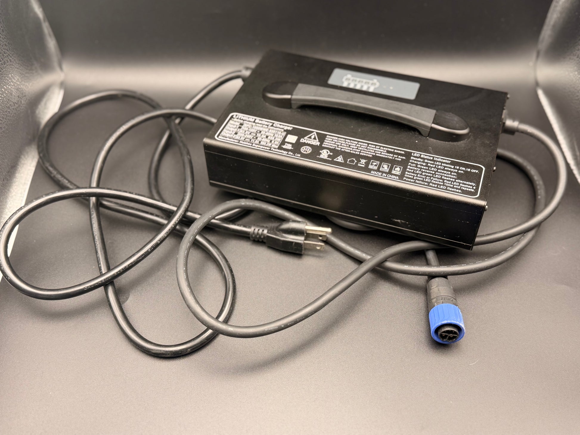 Greenger OEM battery charger for G3 and G3S models, shows the compact charging device with power cord and LED indicators.