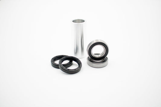 Yamaha 22mm front bearing kit by Warp9Racing, showing assembled bearings and components on a clean workspace.