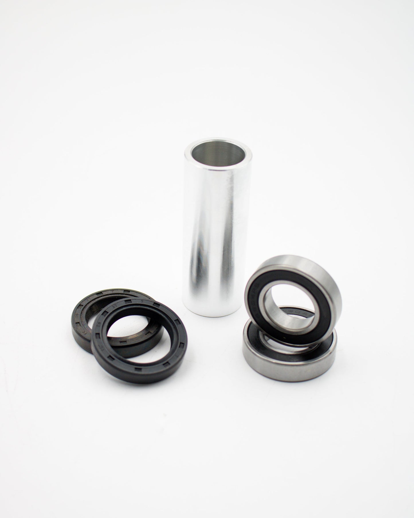 Suzuki DRZ rear bearing kit by Warp9Racing, showing close-up of bearings and components for motorcycle rear wheel.