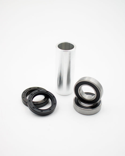Suzuki DRZ rear bearing kit by Warp9Racing, showing close-up of bearings and components for motorcycle rear wheel.
