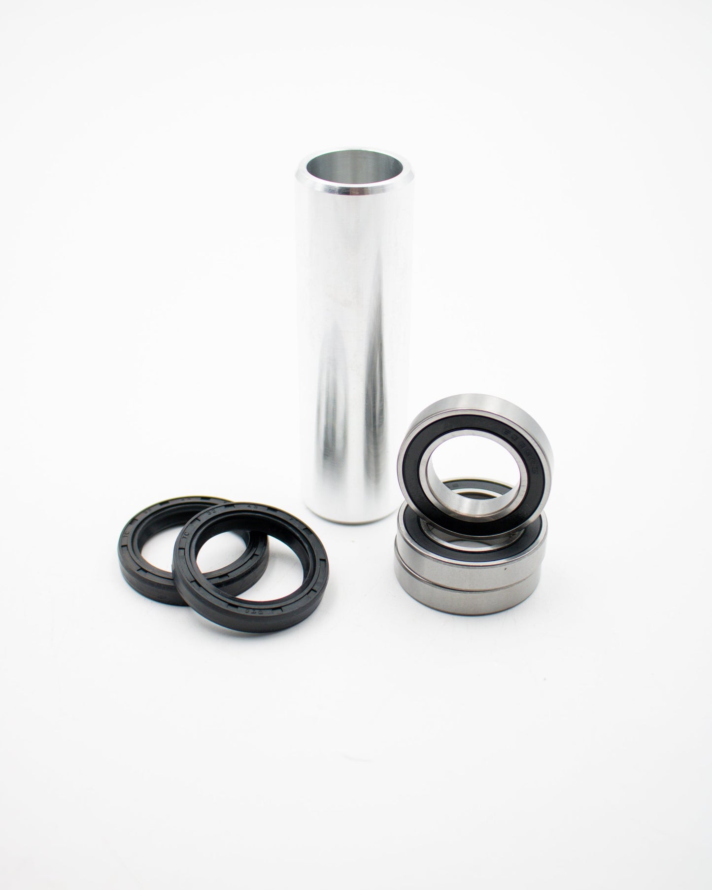 Warp9Racing Suzuki RMZ rear wheel bearing kit installed on motorcycle wheel with visible bearing and rim components.