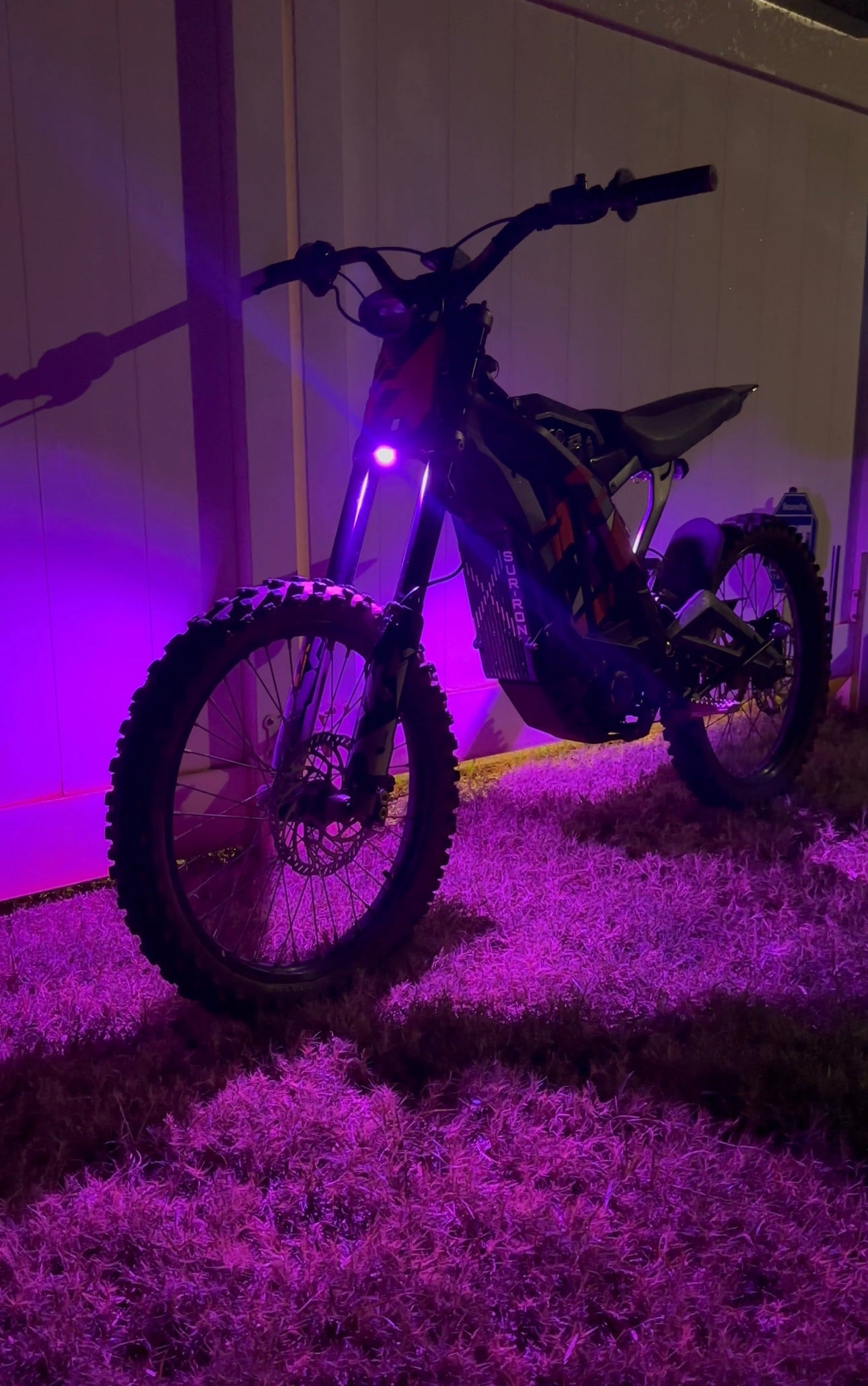 Project 9 HyperGlow Underglow Kit for E Ride Pro 3.0 and SR, showing front and rear LED underglow lights on a vehicle.