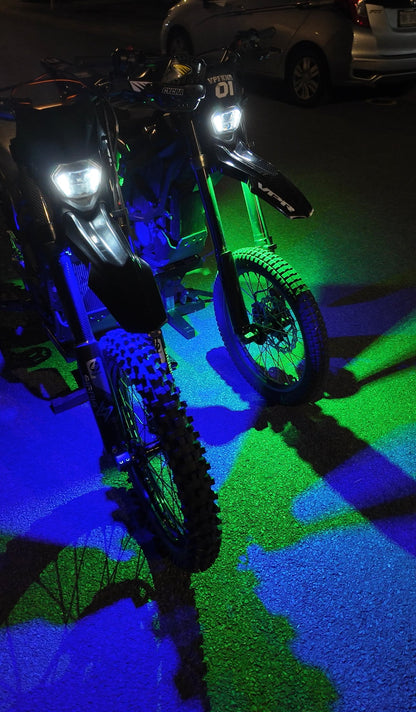Project9 Hyperglow Surron Ultra Bee complete under glow kit with front and rear lights on Surron electric bike.