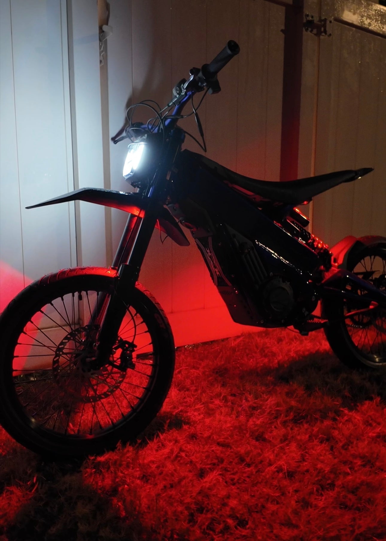 Project9 Hyperglow Surron Ultra Bee complete kit with front and rear under glow lights on a Surron electric bike.
