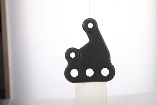 E Ride Pro left footpeg mounting bracket assembly for motorcycle, showing the sturdy metal bracket with mounting points.