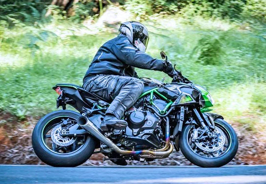 Polished titanium Vandemon exhaust system for Kawasaki Ninja ZH2, open box from Bill's Exhausts, showing sleek exhaust pipe and fittings.