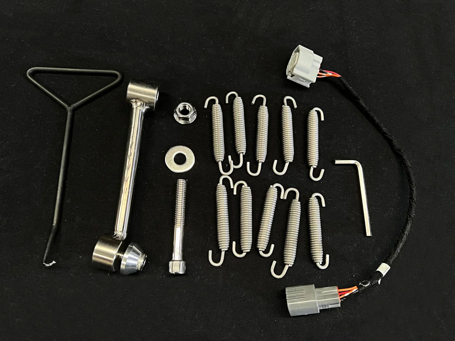 Kawasaki ZH2 polished titanium exhaust system by Bill's Exhausts, shown with mounting hardware and fitting kit for Ninja ZH2 2020-25