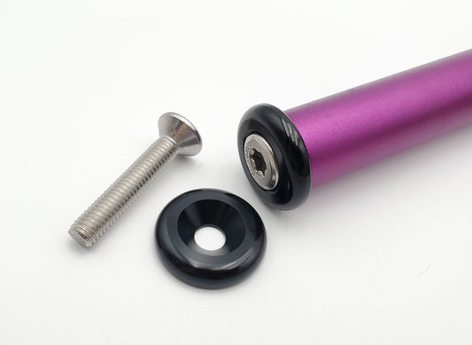 Warp9Racing tapped handlebar ends installed on a bicycle handlebar, showcasing durable metal construction and secure fitting.