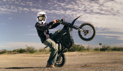 Yozma IN 10 electric mini dirt bike with 2600W motor, black and red design, ready for off-road riding.