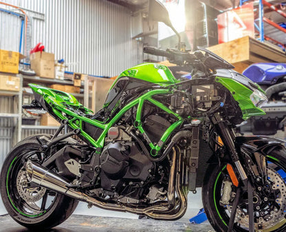Vandemon polished titanium exhaust system installed on Ninja ZH2 motorcycle, showcasing sleek metallic finish and exhaust pipes.