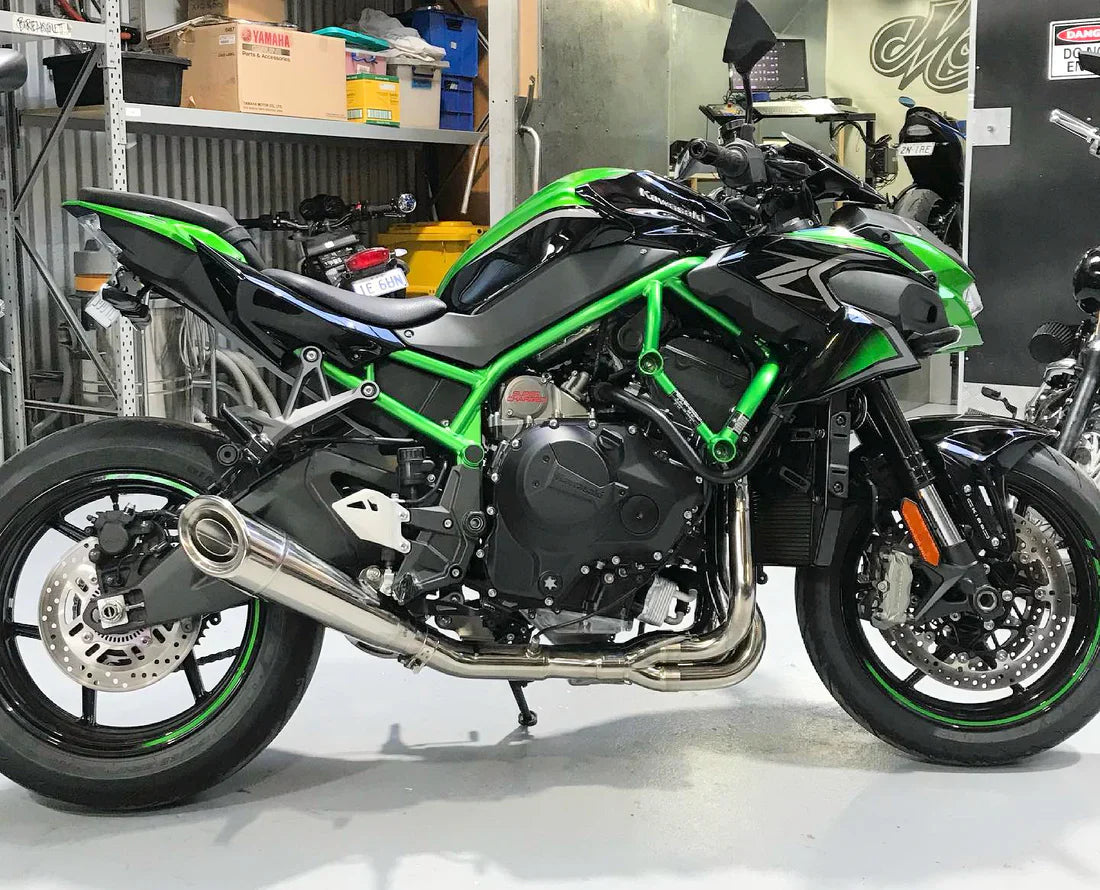 Vandemon polished titanium exhaust system on Ninja ZH2 motorcycle, full titanium finish, installed and showcasing sleek design.