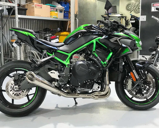 Vandemon polished titanium exhaust system on Ninja ZH2 motorcycle, full titanium finish, installed and showcasing sleek design.
