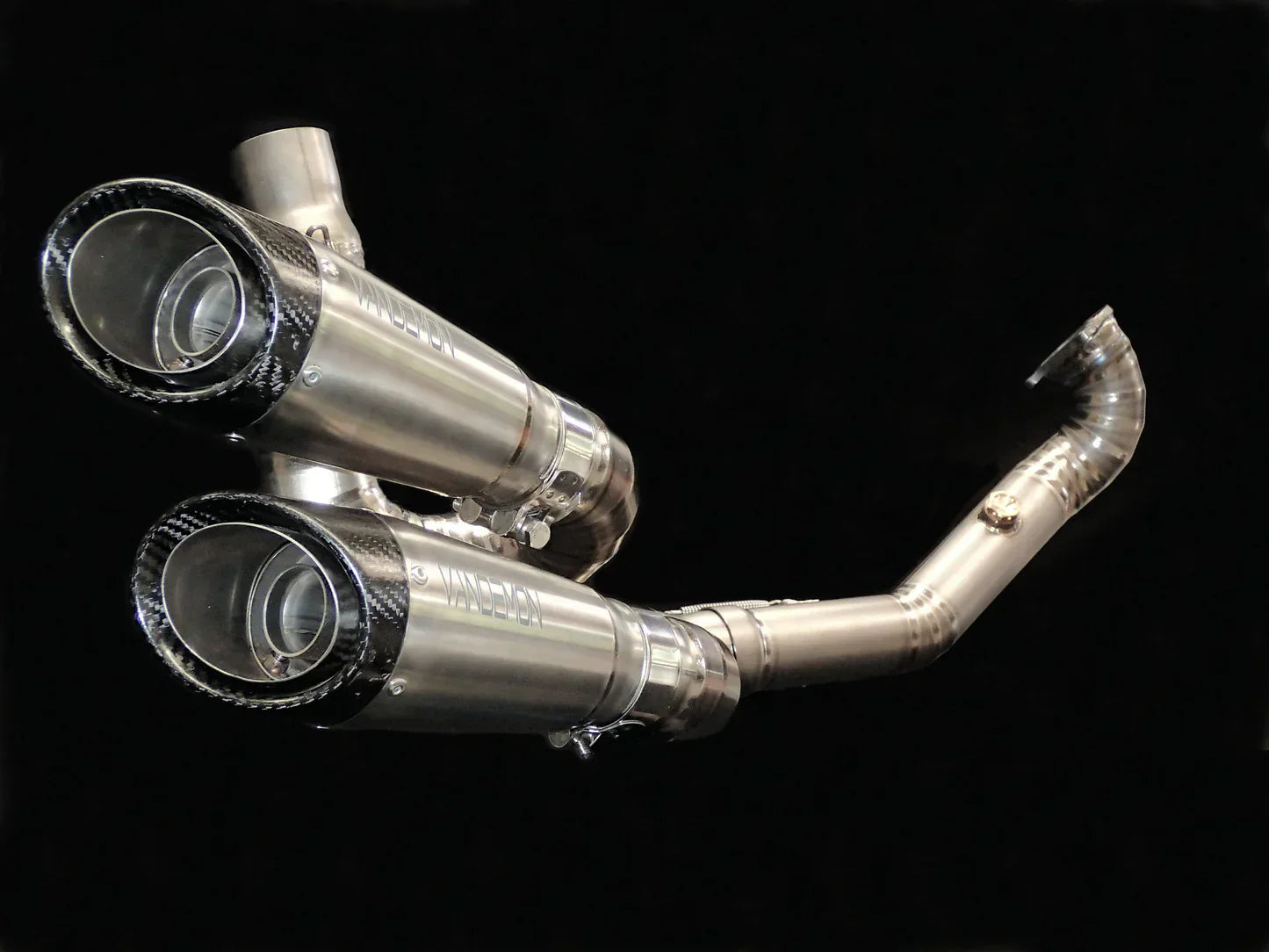 Ducati XDiavel and Diavel S Vandemon titanium exhaust system installed on a motorcycle, showcasing sleek metal finish and exhaust pipes.