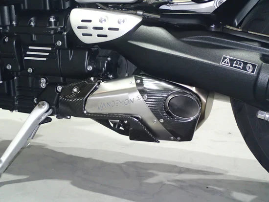 Open box Vandemon Triumph Rocket 3R & GT titanium stealth slip-on mufflers, motorcycle exhausts with sleek metallic finish.