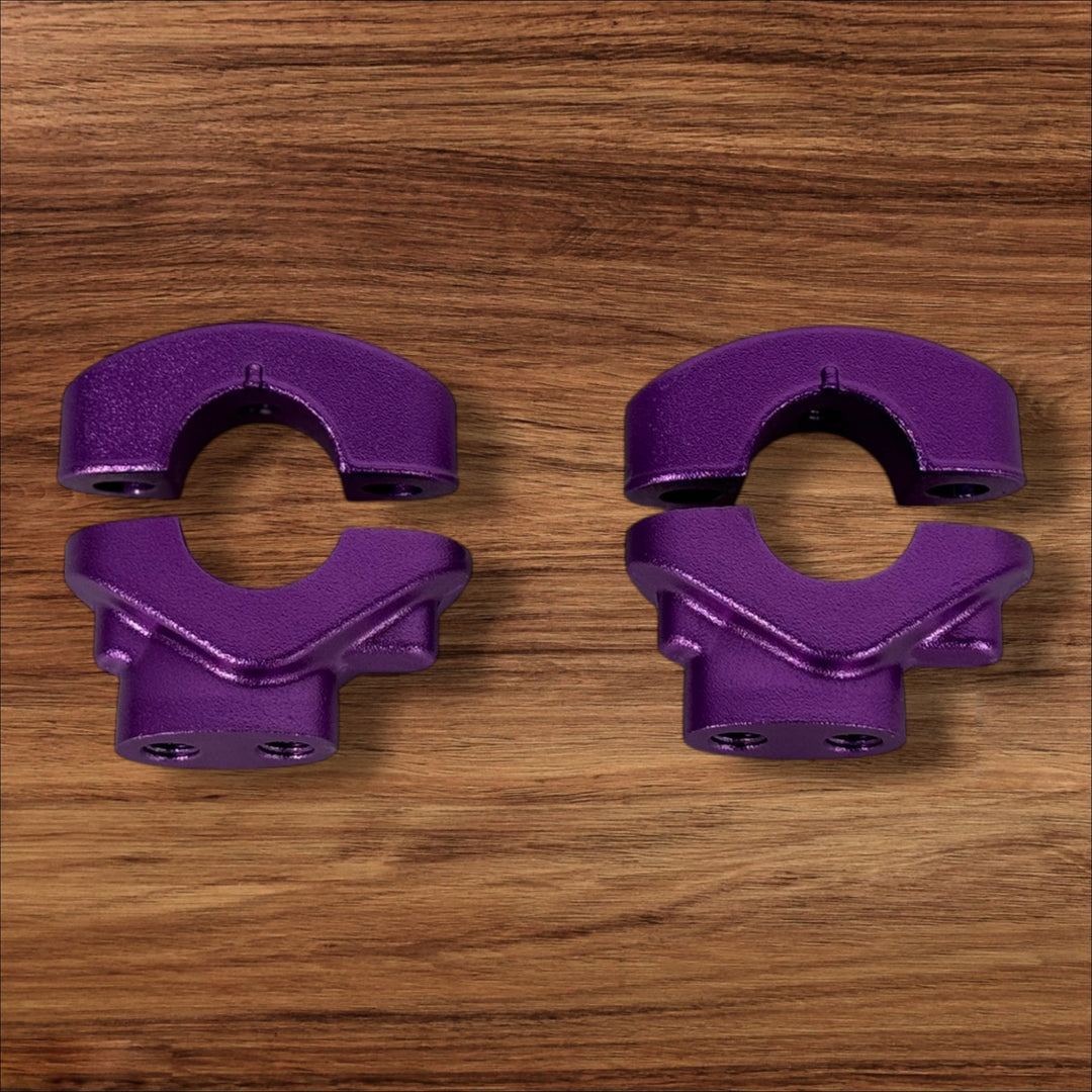 Electro & Co ETM RTR anodized handlebar clamps set in black, red, blue, green, and purple for secure mounting.