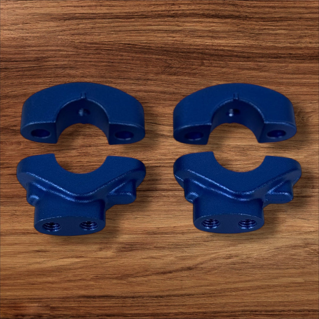 Electro & Co ETM RTR anodized handlebar clamps set in black, red, blue, green, and purple for secure mounting and adjustment.