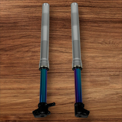 Electro & Co ETM RTR Oil Slick forks with fully adjustable suspension and multi-color finish on a bicycle.