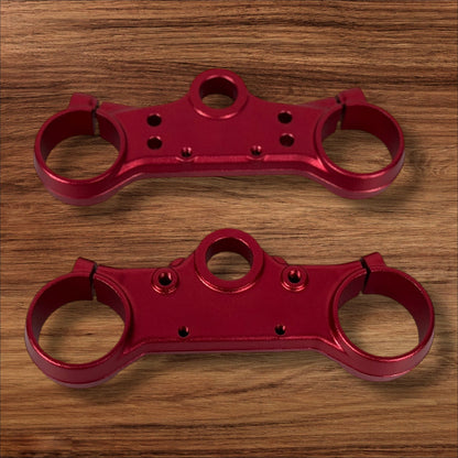 Electro & Co ETM RTR anodized triple clamps, custom color upper and lower replacement clamps for motorcycle steering.