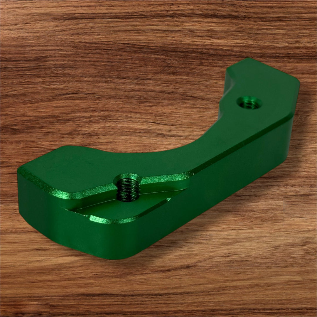 Electro & Co ETM RTR anodized brake brackets set in black, red, blue, green, and purple for front and rear bicycle brake systems