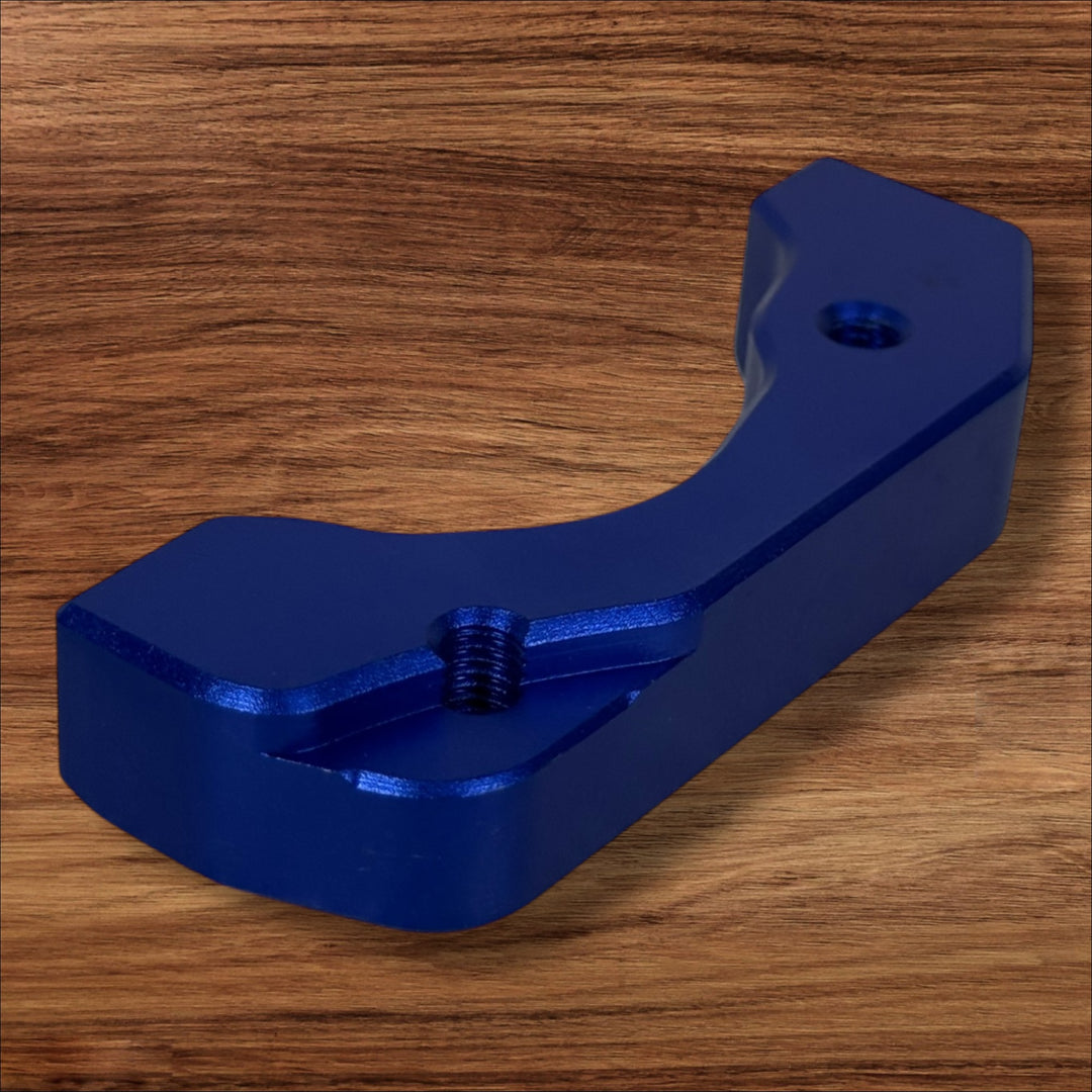 Electro & Co ETM RTR anodized brake brackets set in black, red, blue, green, and purple for front and rear motorcycle braking systems.